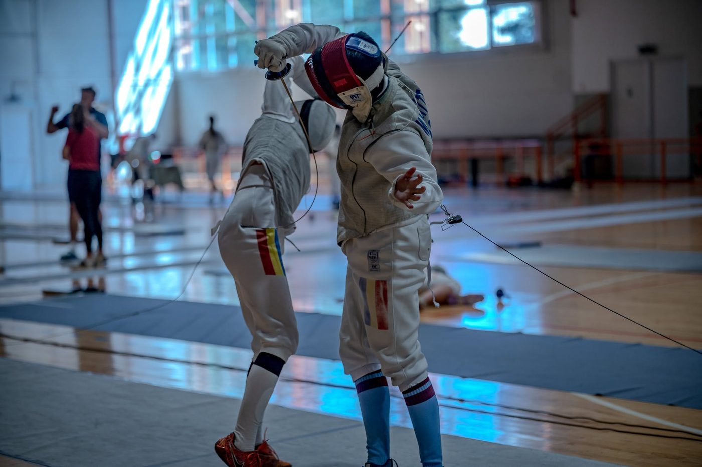 Fencers bouting during the International Foil Camp